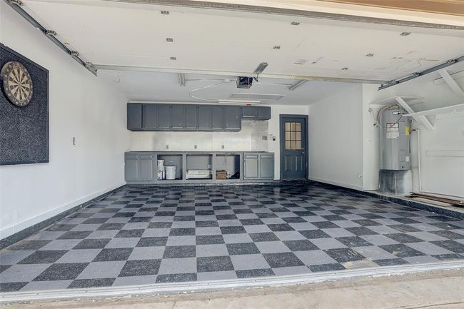 Garage. Check out all of the storage cabinets and the garage flooring | Image 28
