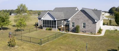 Sitting on 5 acres, it has a partially fenced back yard for your pets | Image 2