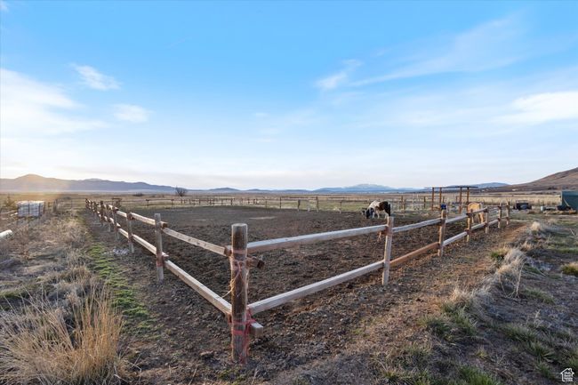 View of yard featuring a rural view, a mountain view, and fence | Image 5
