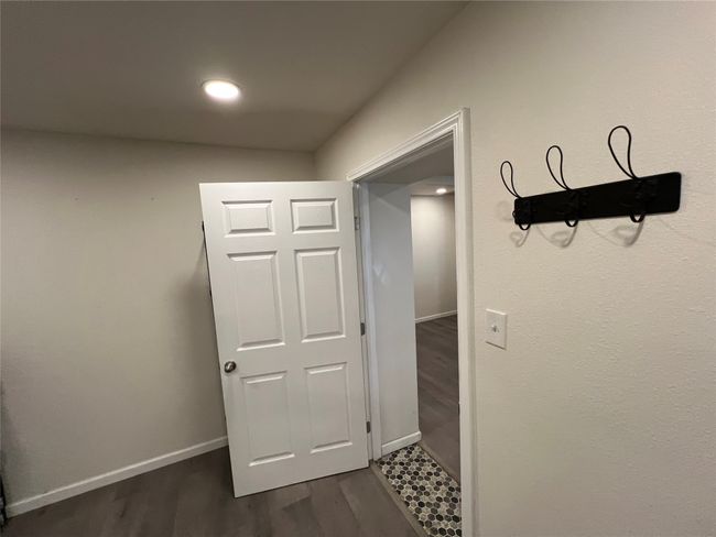 Corridor featuring dark wood-style floors, baseboards, and recessed lighting | Image 31