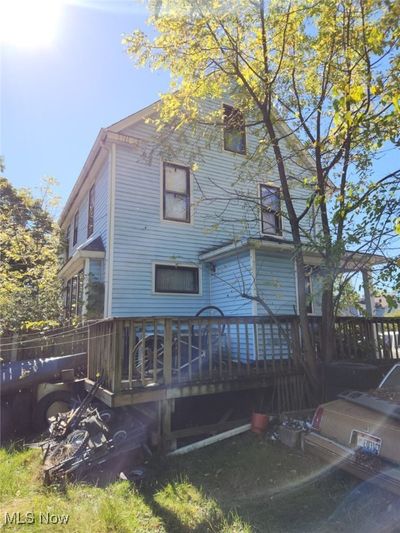 Back of house featuring a wooden deck | Image 1