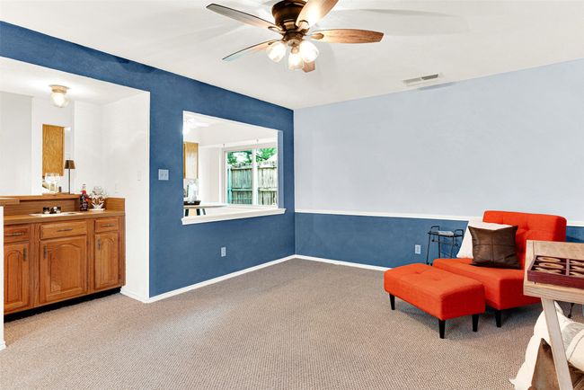 Family Room featuring light colored carpet and ceiling fan | Image 25
