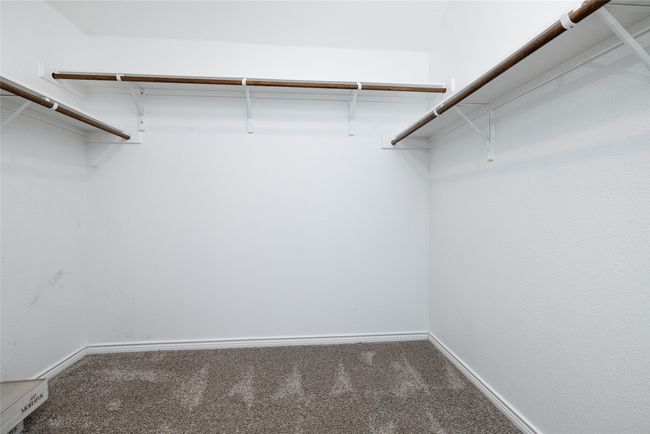 Walk-in closet in primary bedroom | Image 23