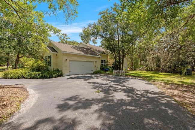 11933 Pasco Trails Blvd, House other with 4 bedrooms, 3 bathrooms and null parking in SPRING HILL FL | Image 32