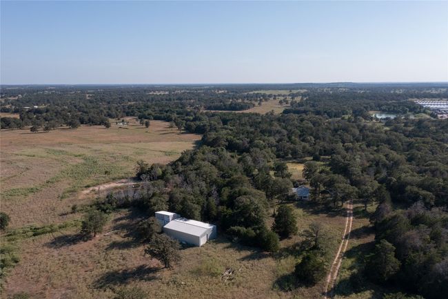 Aerial view of property's location featuring a forest | Image 10