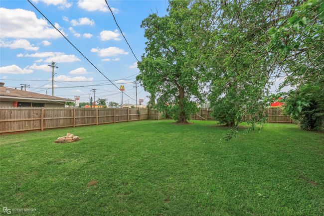 View of yard with a fenced backyard | Image 21
