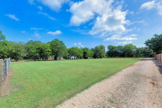 View of yard with view of wooded area | Image 10