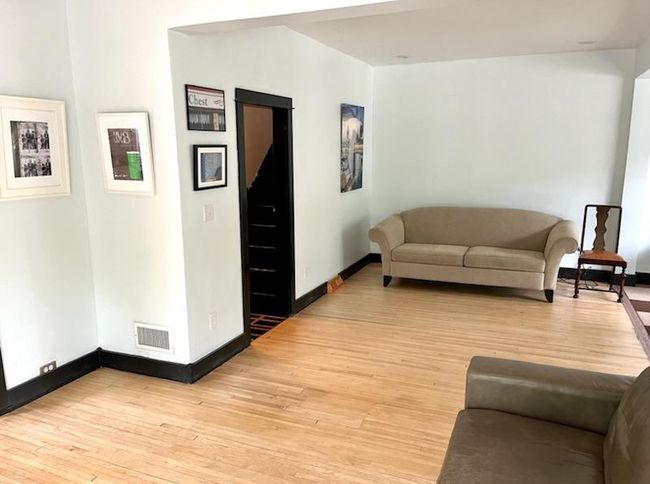 Looking into the living room to the front entryway. | Image 7