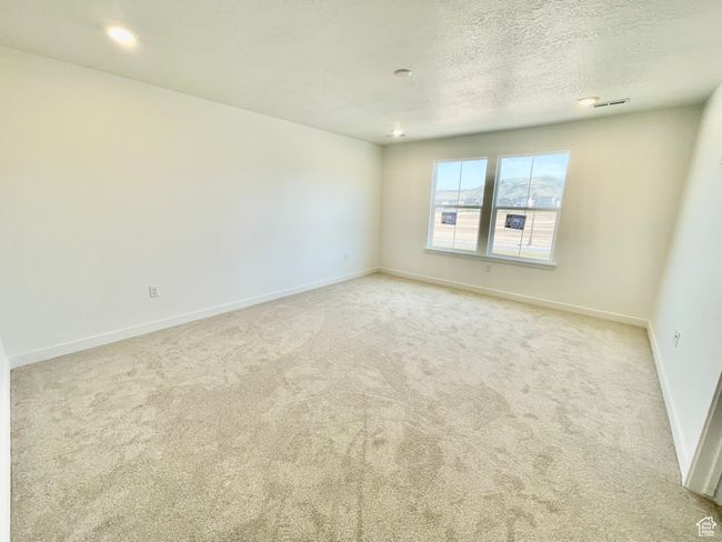 Carpeted spare room with baseboards and a textured ceiling | Image 11
