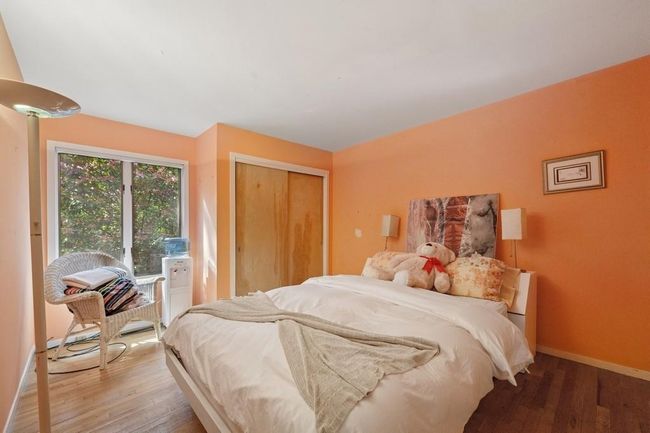 Bedroom with hardwood / wood-style floors, baseboards, a closet, and access to outside | Image 7