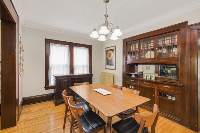 The incredible original custom built-in in the dining room is not only stunningly beautiful but offers excellent storage. | Image 11