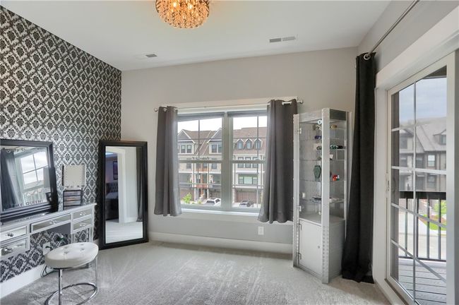 The custom LED lighted tray ceiling with modern fan showcases the alternative style of the space. | Image 32