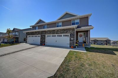 911 Creekside Drive, Condo with 4 bedrooms, 3 bathrooms and null parking in Tiffin IA | Image 1