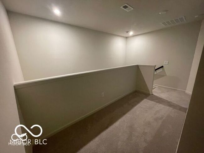 interior space featuring baseboards, carpet, visible vents, and recessed lighting | Image 12