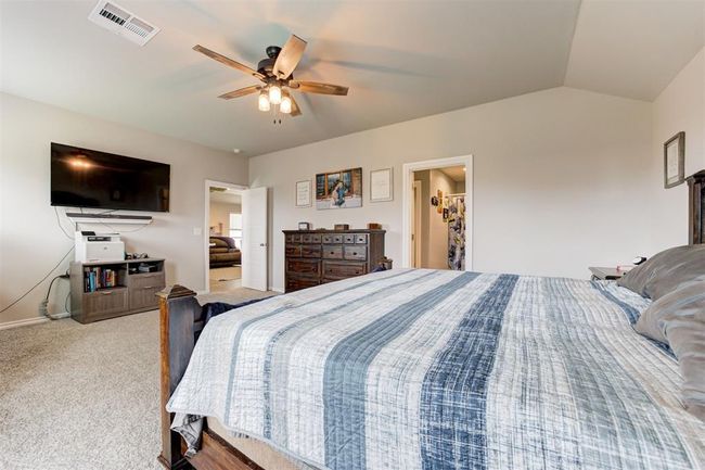Bedroom with carpet, a ceiling fan, and vaulted ceiling | Image 22
