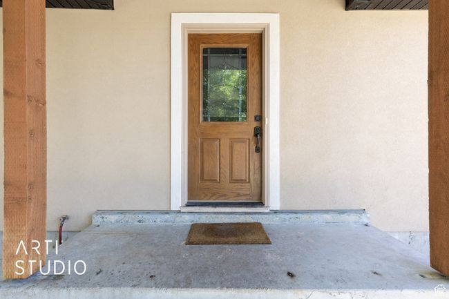 Entrance to property with stucco siding | Image 36