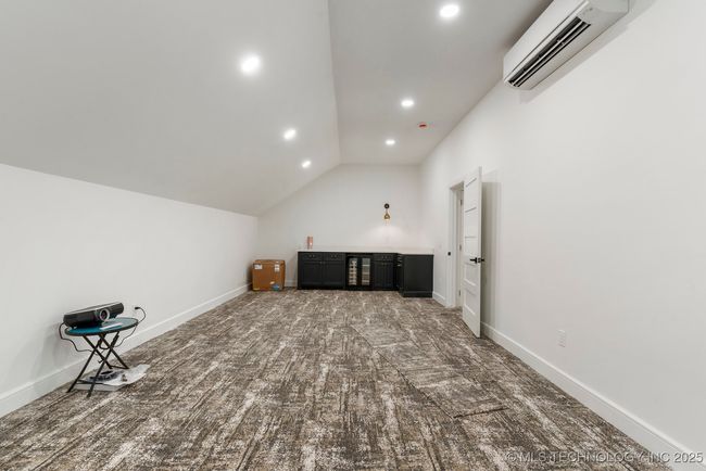 Upstairs game room or theatre room with bathroom | Image 62