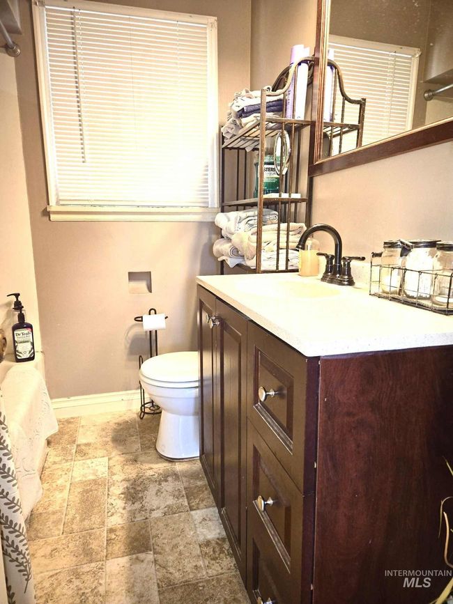 Bathroom with vanity and stone finish flooring | Image 10