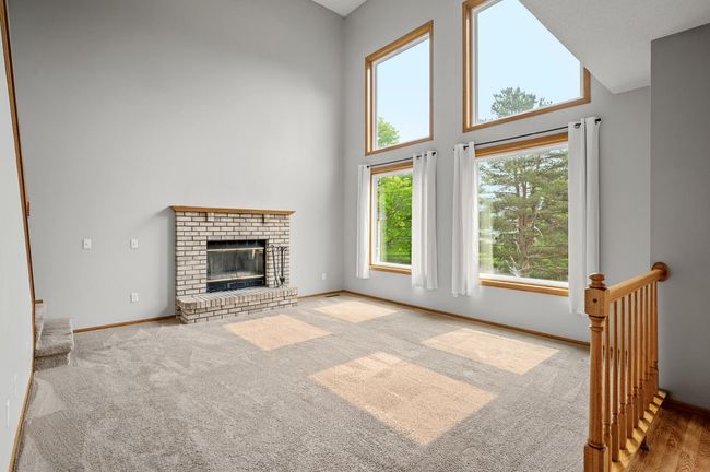Your two-story great room has amazing views! Wood burning fireplace is great for those long Minnesota winters. | Image 9