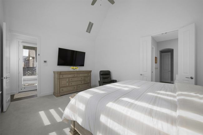 Primary Bedroom showing the double door entry to the primary bathroom. | Image 18