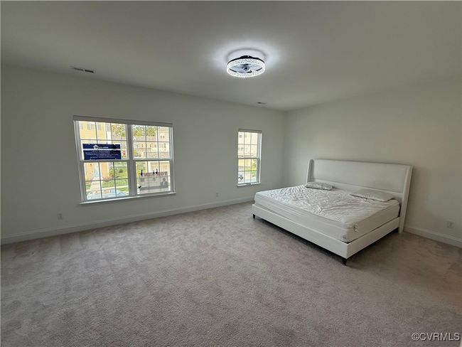 Carpeted bedroom with baseboards | Image 14