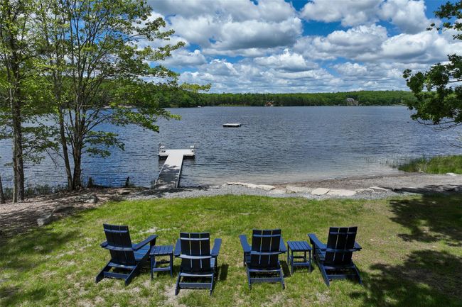 View of yard with a water view and a dock | Image 44