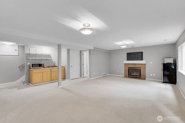 another view of the lower level with fireplace and separate entrance | Image 23