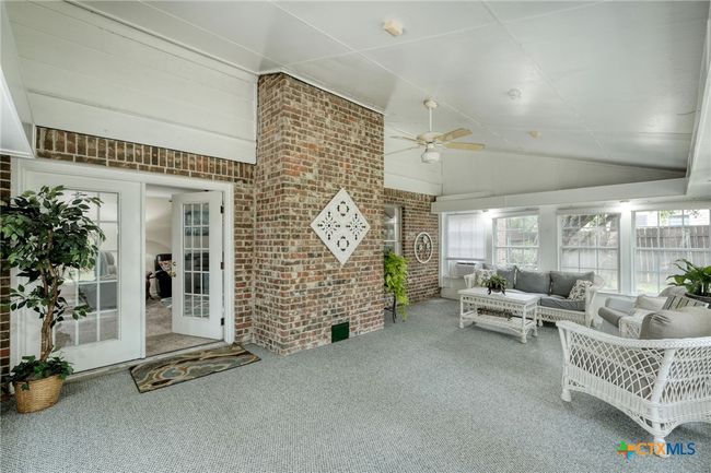 Sunroom has lots of room for extended entertaining space. There is plenty of room for a game table or even air hockey. | Image 25