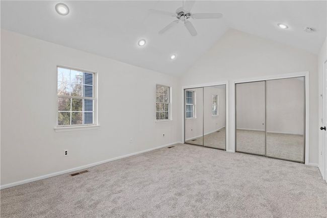 Primary bedroom with high ceilings and double closets. | Image 7