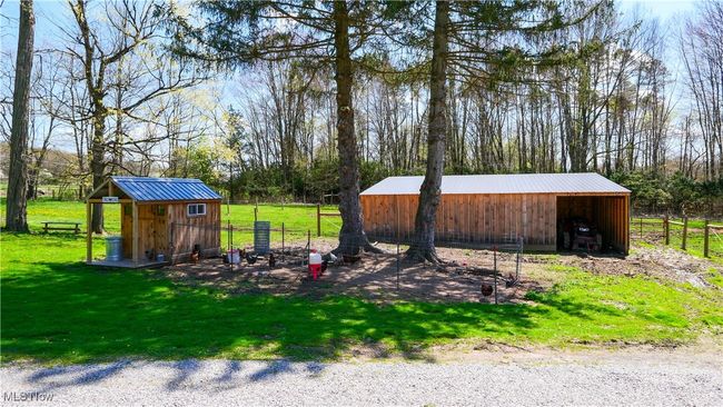 View of pole building with fence and a yard | Image 34