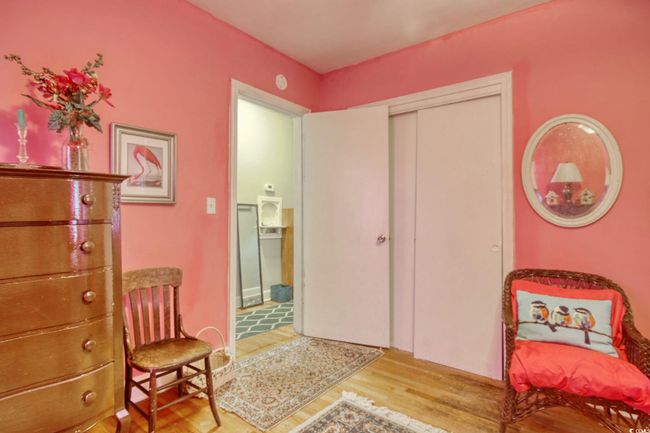 Sitting room with wood finished floors | Image 24