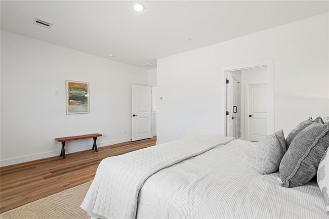 Large windows and an open layout make this primary suite feel bright, airy, and perfect for relaxation. | Image 19