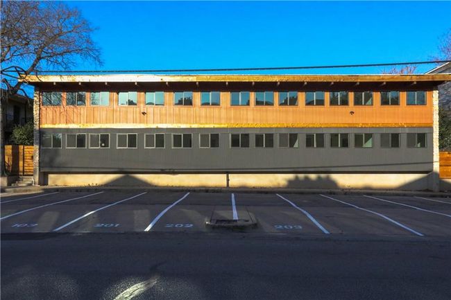 View of building exterior with uncovered parking | Image 16