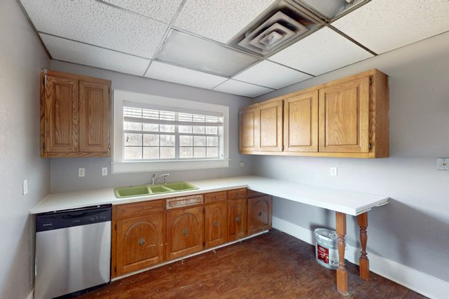 Kitchen featuring sink, a drop ceiling, and dishwasher | Image 23