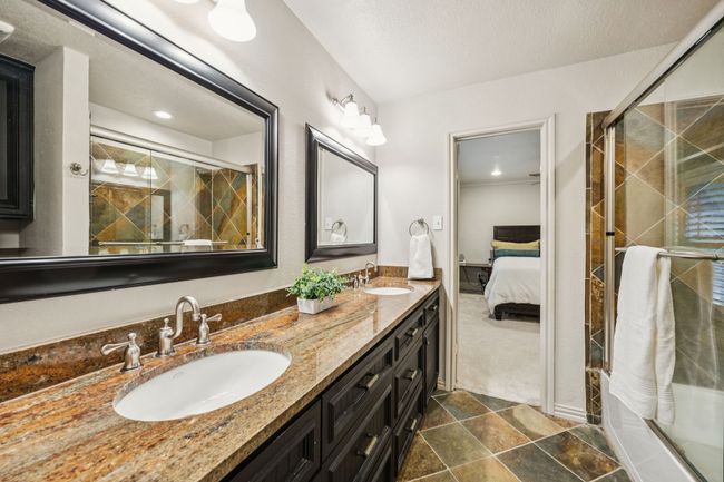 Jack and Jill bathroom connects two guest bedrooms. | Image 18