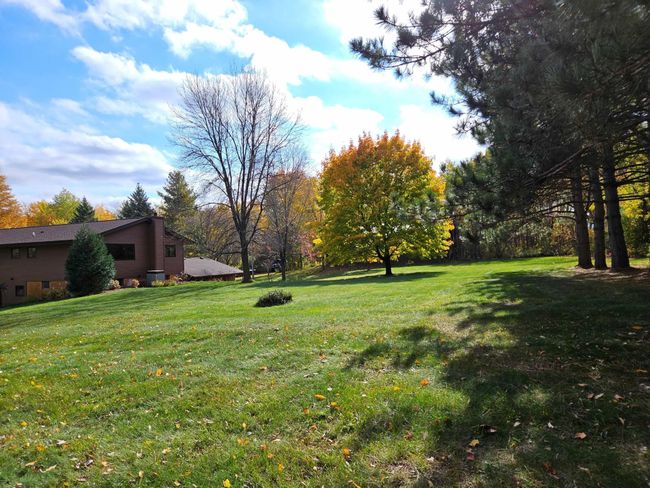 The backyard features a generous flat area, perfect for games, a garden, or outdoor entertaining. | Image 61