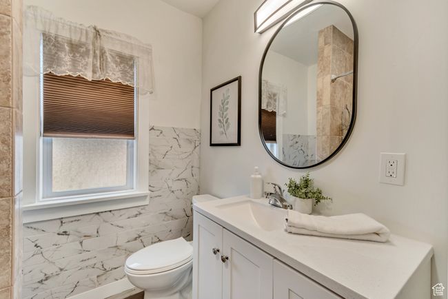 Bathroom featuring vanity and toilet | Image 15