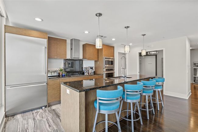 Enjoy entertaining from the kitchen island, open to the living room! | Image 17