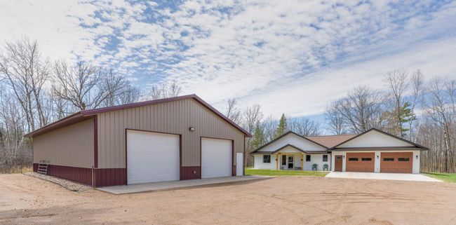 40 x 56 building has Heated Workshop (3) - 12 × 10 Ft Garage Doors (2 with openers) | Image 25