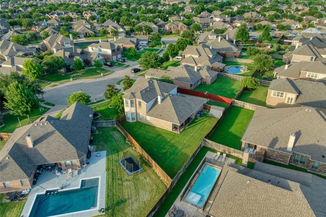 View of property location featuring a pool area and nearby suburban area | Image 35