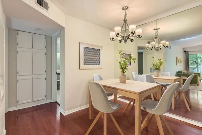 *Virtually Staged*Dining space featuring a chandelier and dark wood-type flooring | Image 5