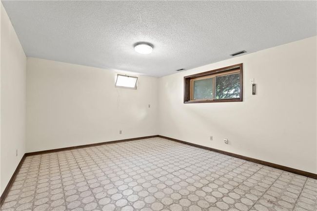 Empty room featuring baseboards and a textured ceiling | Image 20