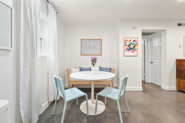 Dining space featuring baseboards and finished concrete flooring | Image 9