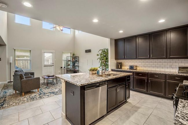 The open floorplan of the home looks out onto the family room. | Image 11