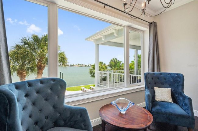Master bedroom sitting area with partial view of the back balcony... and that amazing wide open water view of Boca Ciega Bay. | Image 47