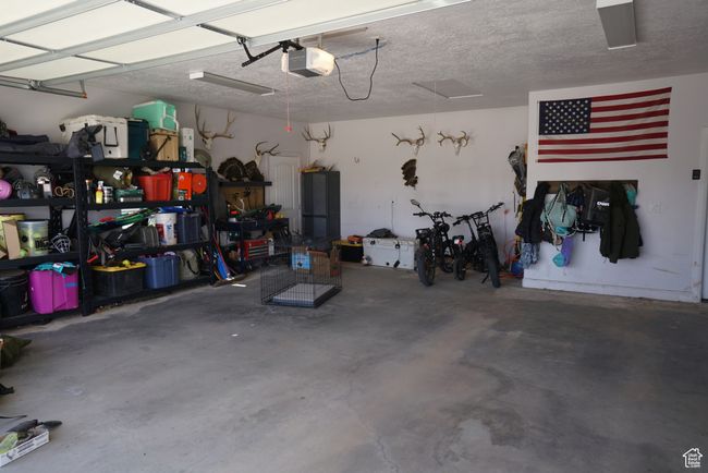 Garage featuring a garage door opener | Image 20