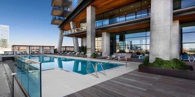 Community pool with a patio | Image 19