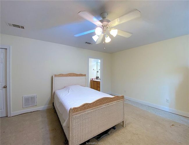 Bedroom featuring baseboards, light carpet, and ceiling fan | Image 9