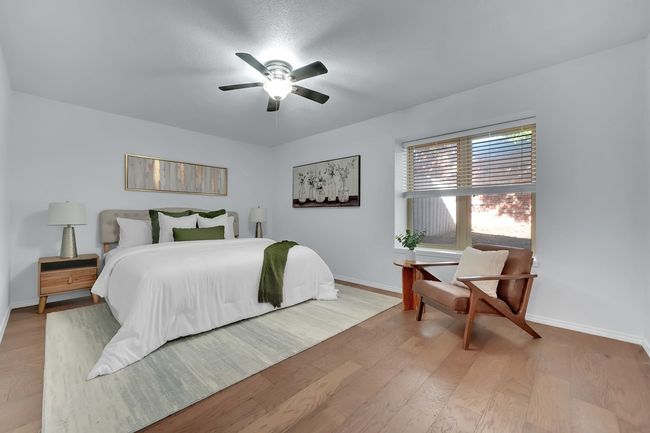 Bedroom featuring wood finished floors and ceiling fan | Image 35