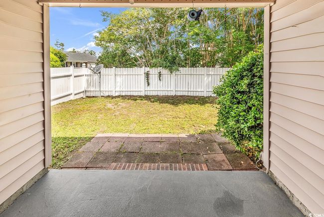 View of yard with a patio and fence | Image 21